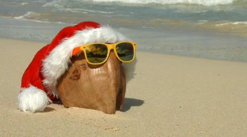 Santa hat for Christmas And Coconut On Tropical Hawaii Beach Stock Footage 57719062