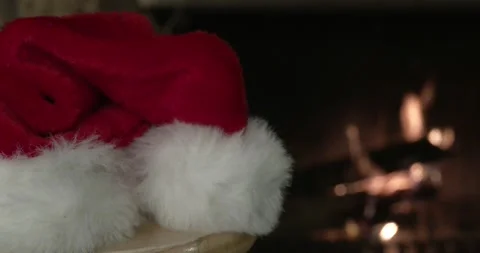 Santa Hat in Front of Fireplace - Depth of Field Stock Footage 167131471