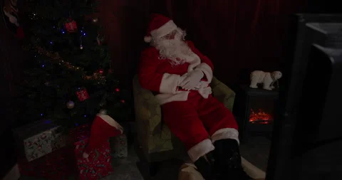 Santa is in His Grotto Watching TV Video stock 219065341