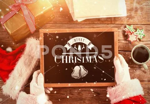 Santa holding a Christmas board PSD Template