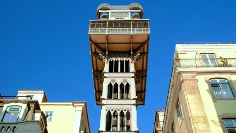 Santa Justa elevator and its cabin going up, Lisbon, Portugal on sunny day Stock Footage 342702481