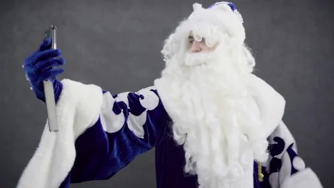 Santa makes selfi on smartphone Stock Footage 76325878