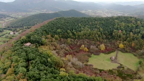 The Santa Margarida volcano with a hermitage in the centre of its crater Stock Footage 154280478