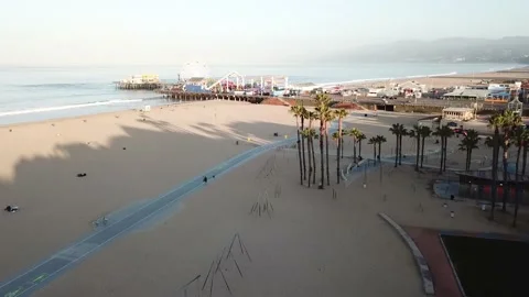 Santa Monica Beach- Drop down to gym rings Stock Footage 208946730