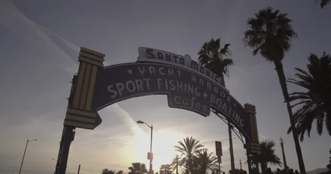 Santa Monica - Tracking Alongside Pier Entry Sign Stock Footage 87381739