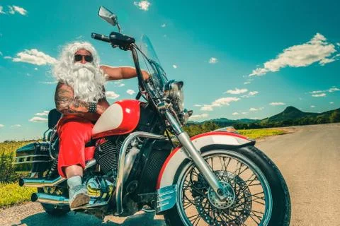 Santa on a motorcycle Stock Photos