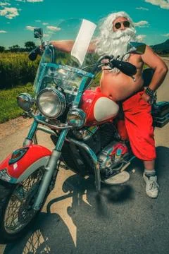 Santa on a motorcycle Stock Photos