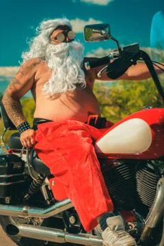 Santa on a motorcycle Stock Photos