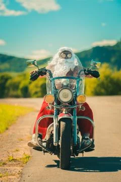Santa on a motorcycle Stock Photos