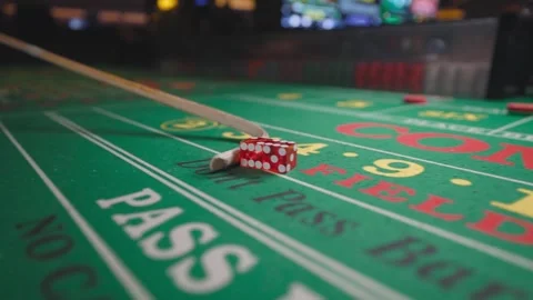 Santa Picks Up Craps Dice from Casino Table Stock Footage 318587855