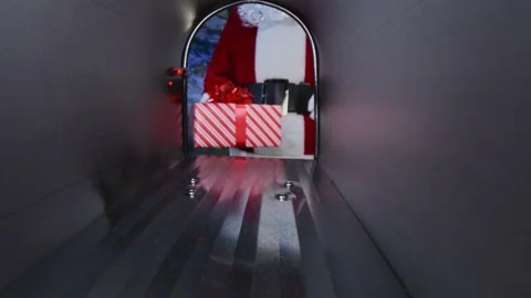 Santa placing a Christmas present in a rural mailbox, viewed from inside. Stock Footage 166357441