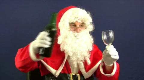 Santa pours a drink Stock Footage 77681