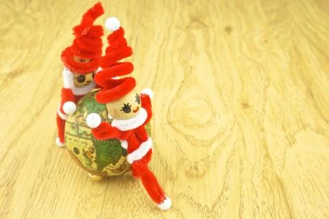 Santa rolling the globe on left Stock Photos