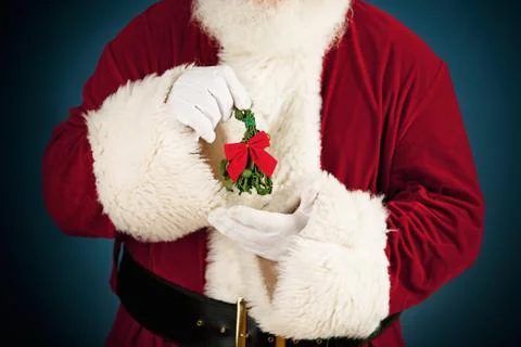 Santa: santa holding mistletoe Stock Photos