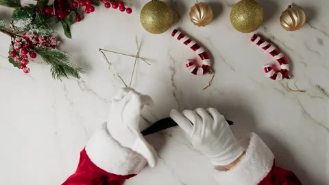 Santa searching for money inside empty wallet Stock Footage 255583757