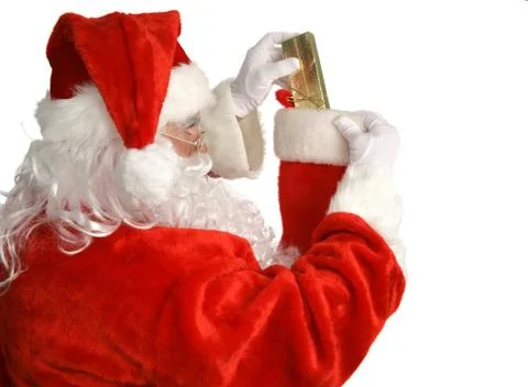 Santa Stuffs Stocking Stock Photos