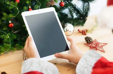 Santa with tablet Stock Photos