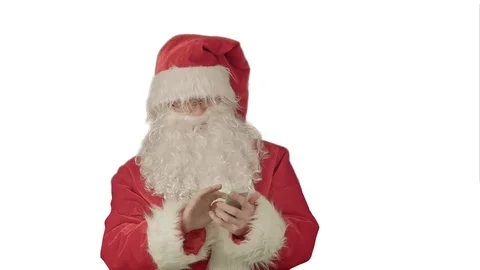 Santa talking on his cellphone with a surprised look on his face. on white Stock Footage 70610902