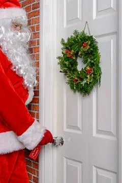 Santa using his magic key Stock Photos
