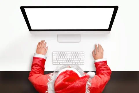 Santa work on computer with isolated screen for mockup. View from above, top  Stock Photos
