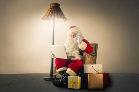 Santa in work Stock Photos