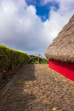 Santana triangular thatched house and red facade by the sea, Madeira Stock Photos