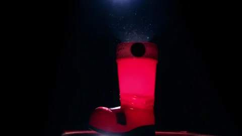 Santa's boot in a ray of light Stock Footage 258837066
