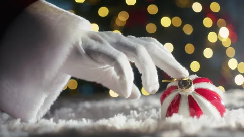 Santa's hand moves colored ball Stock Footage 257205455