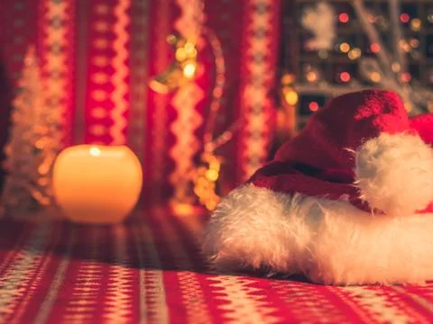 Santa's hat on Christmas pattern table Stock Photos