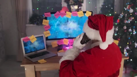 Santa's helper talking on phone while delivering gifts surprises on New Year Stock Footage 287276878