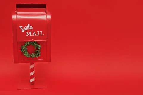 Santa's mailbox on red background with copy space Stock Photos