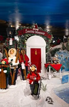 Santa's workshop christmas display with winter dolls Stock Photos