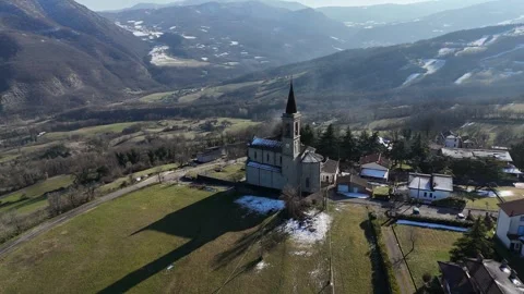 Santi Salvatore e Gallo bell tower rising above a quiet I Rabbini, Morfasso PC Stock Footage 327425627