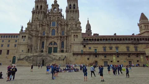 Santiago de Compostela, Spain - Jun 18, 2022: Pilgrims playing at the Cathedral Stock-Footage 201365448