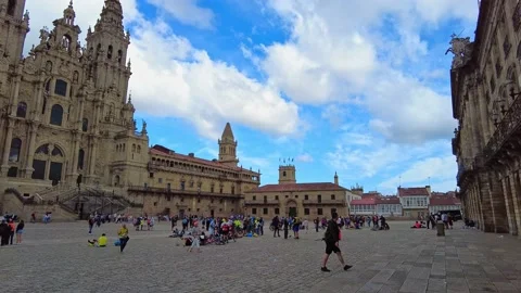 Santiago de Compostela, Spain - Jun 18, 2022: Pilgrims at the Cathedral Stock Footage 201951128