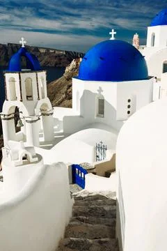 Santorini blue Domes with  steps down white and blue greece island kiklades Stock Photos