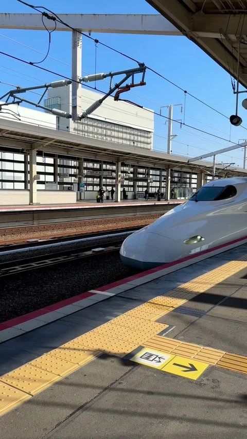 The Sanyo Shinkansen pulls onto the platform at Himeji Station Stock Footage 278575807