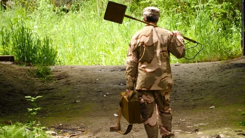 Sapper comes out of the building | Stock Video | Pond5