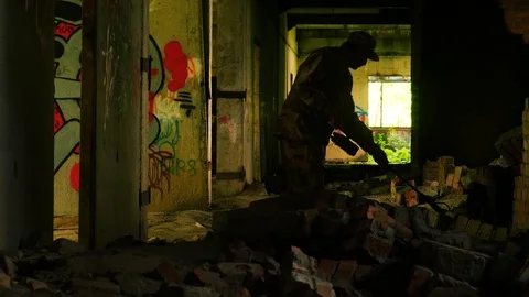 Sapper looking for mines in a ruined building Stock Footage 94366785