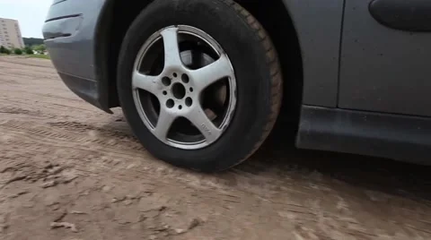 Сar goes on camera, stops with close up wheel, crane shoot Vídeo Stock 47046796