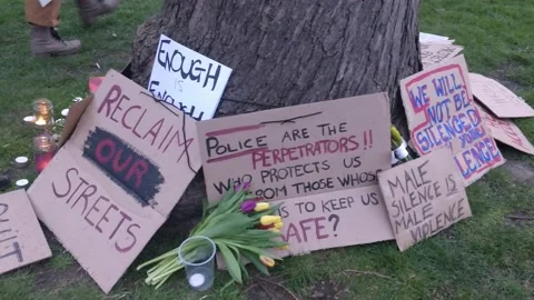 SARAH EVERARD PROTEST PLACARDS LEFT BESIDE TREE SAY RECLAIM THE STREETS UK 4K Stock Footage 150383135