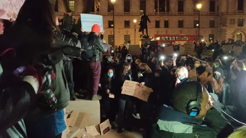 SARAH EVERARD PROTESTERS CHANT 'NO JUSTICE NO PEACE' IN PARLIAMENT SQUARE Stock Footage 150398373