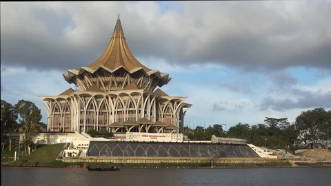 Sarawak State Legislative Building by the river during a day with moving clouds  Stock Footage 125990902