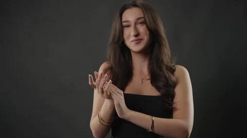 Sarcasm and disapproval concept, young woman clapping slowly with skeptical Stock Footage 336939770