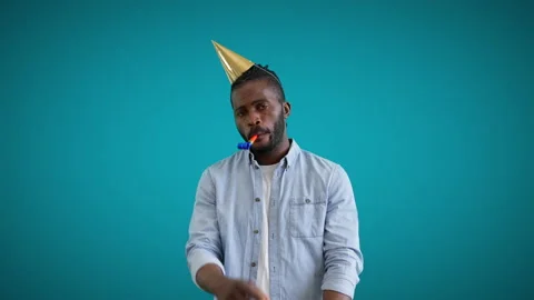 blowing birthday horn