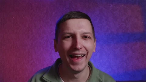Sarcastic man laughing and using magnifying glass for mockery Stock Footage 333757071