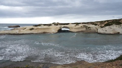 S'Archittu cliffs in a grey mistral storm Stock Footage 105349063