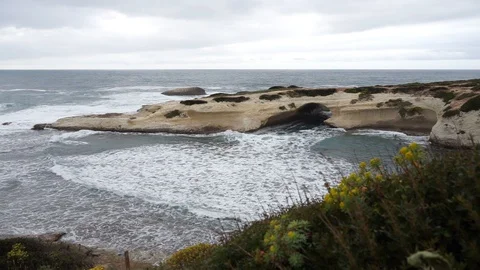 S'Archittu cliffs in a grey mistral storm Stock Footage 105349096