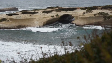 S'Archittu cliffs in a grey mistral storm Stock Footage 105349146