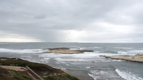 S'Archittu cliffs in a grey mistral storm Stock Footage 105349169